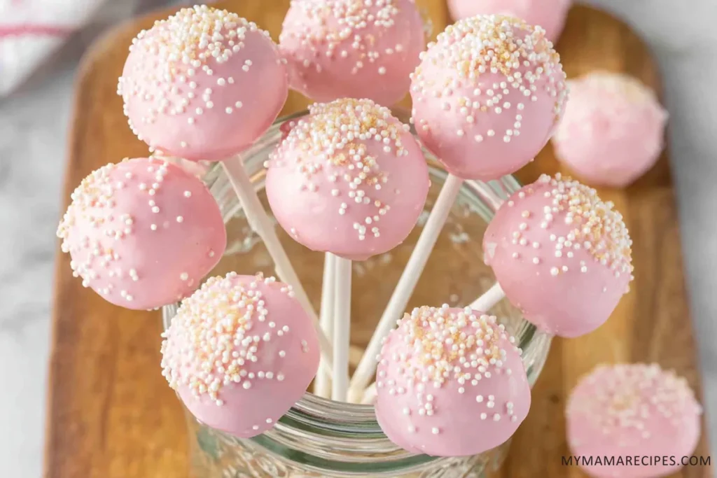 Starbucks Cake Pop Recipe That Tastes Like the Real Thing 18 Decorated Starbucks cake pops with pink coating and sprinkles