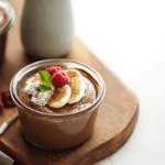 A bowl of chocolate chia pudding served in a cozy home kitchen with natural light