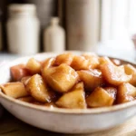 A warm bowl of easy cinnamon apples served in a cozy home kitchen with soft natural light