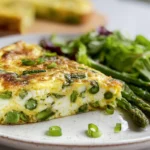 frittata with asparagus leek ricotta served on a modern plate