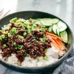 Korean Ground Beef Bowl served over rice with fresh vegetables