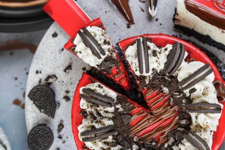 Heavenly Red Velvet Oreo Cheesecake slice on modern plate with Oreo crust
