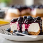 No Bake Blueberry Cheesecake served on a white plate in a cozy home kitchen