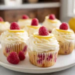Raspberry Lemon Cupcakes topped with lemon cream cheese frosting and fresh raspberries