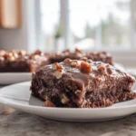 Turtle Texas Sheet Cake with chocolate frosting caramel and pecans