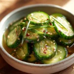 Asian pickled cucumbers served in a modern bowl on a kitchen counter