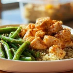 meal prep baked lime chicken bowls served with quinoa and green beans