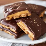 Freshly plated no bake buckeye graham crackers stacked on a modern white plate