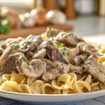 Old fashioned beef stroganoff served creamy and warm on a ceramic plate