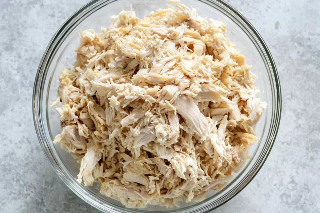 Zucchini Chicken Alfredo Roll Ups for an Easy Low-Carb Dinner 2 Shredded cooked chicken prepared for Zucchini Chicken Alfredo Roll Ups