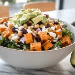 Sweetpotato Power Salad with roasted sweetpotatoes, kale, avocado, and maple balsamic dressing