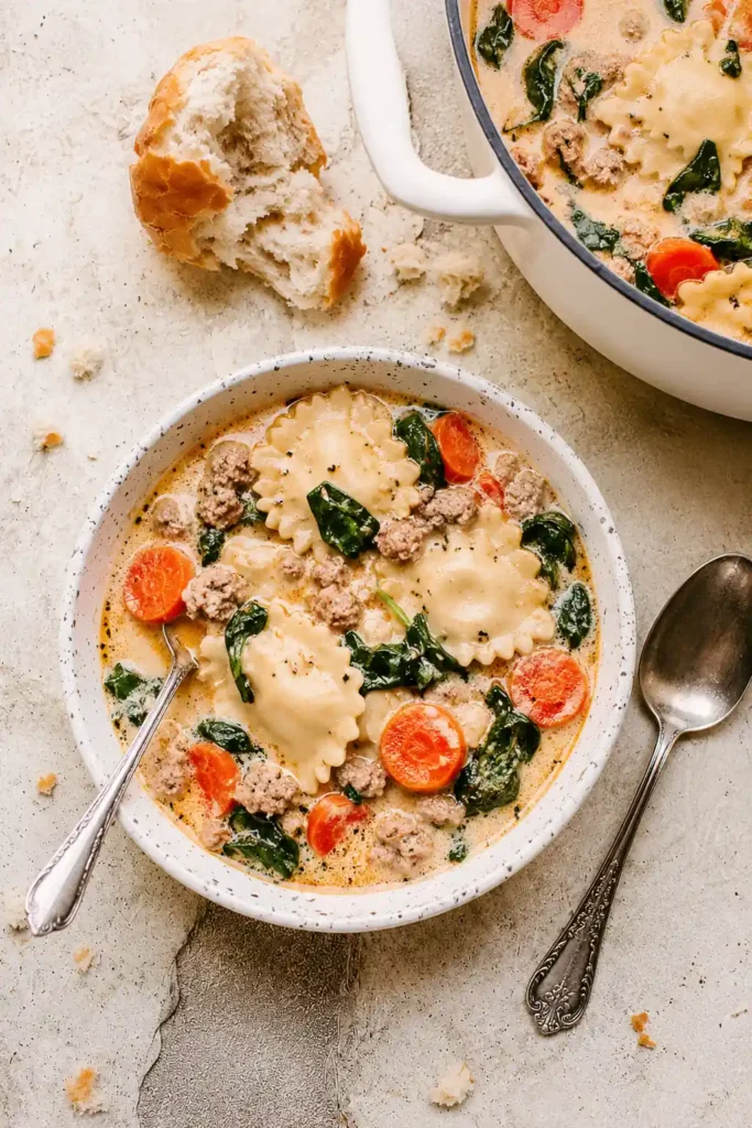 Creamy Ravioli Soup for a Cozy One-Pot Weeknight Dinner 6 Creamy Ravioli Soup served with crusty bread for dinner