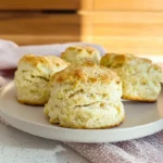 Freshly baked scones showing flaky layers and golden texture, demonstrating how to make perfect scones at home