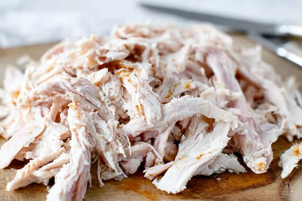 Shredded cooked chicken prepared for keto chicken soup