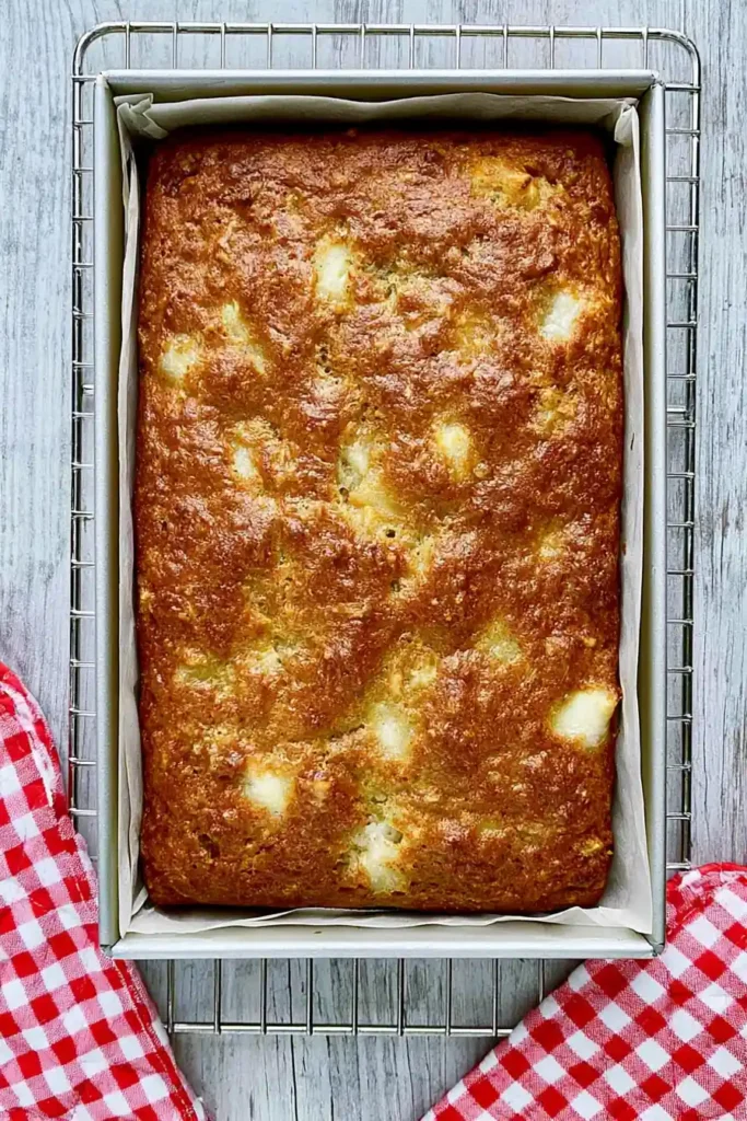 Chewy Apple Brownies with Cinnamon and Walnuts 4 Golden apple brownies baked in a parchment-lined 9×13-inch pan