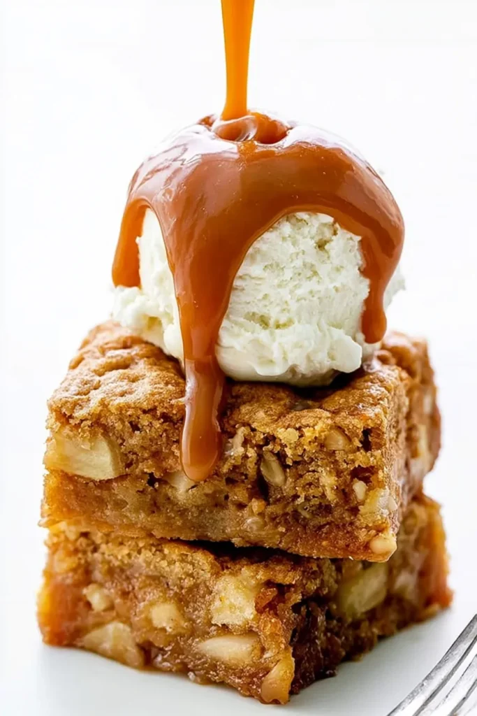 Chewy Apple Brownies with Cinnamon and Walnuts 7 Warm apple brownies with vanilla ice cream served as a simple fall dessert