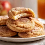Apple Cider Cheesecake Cookies – The Cozy Fall Treat You’ll Crave All Year 7 golden apple cider cheesecake cookies filled with creamy cheesecake center on modern kitchen counter