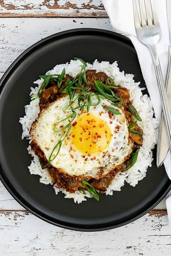 Authentic Loco Moco with Mushroom Gravy and Fried Egg 10 Authentic loco moco served with jasmine rice, mushroom gravy, and fried egg