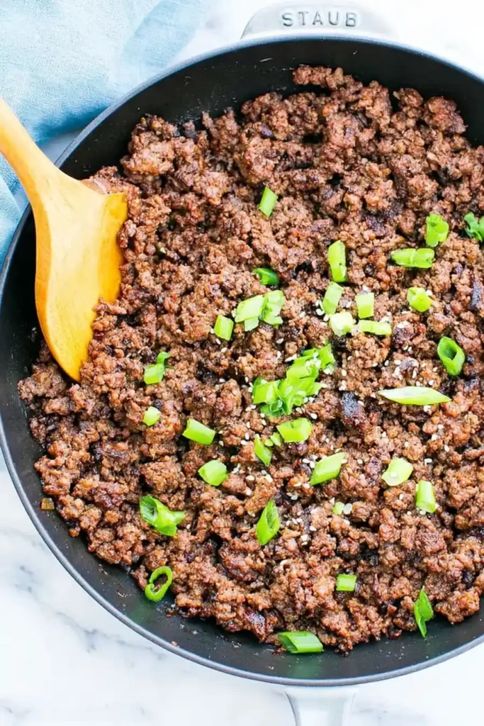 Korean Ground Beef Bowl for a Fast Weeknight Dinner 2 Korean Ground Beef Bowl filling cooked in a skillet with green onions and sesame seeds