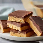 no bake dessert peanut butter bars served on a modern plate in bright kitchen