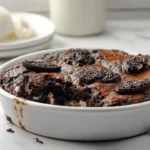 Oreo Dump Cake fresh from oven with melted chocolate and cookie topping
