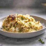 Slow Cooker Parmesan Herb Chicken Orzo – A Comforting One-Pot Dinner You’ll Crave 11 creamy slow cooker parmesan herb chicken orzo served in a white bowl with fresh parsley garnish