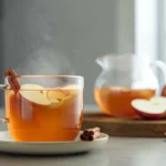 Photorealistic Apple Cinnamon Tea hero shot in modern kitchen