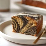 Hero shot of Black Sesame Vanilla Swirl Cake slice on modern kitchen counter