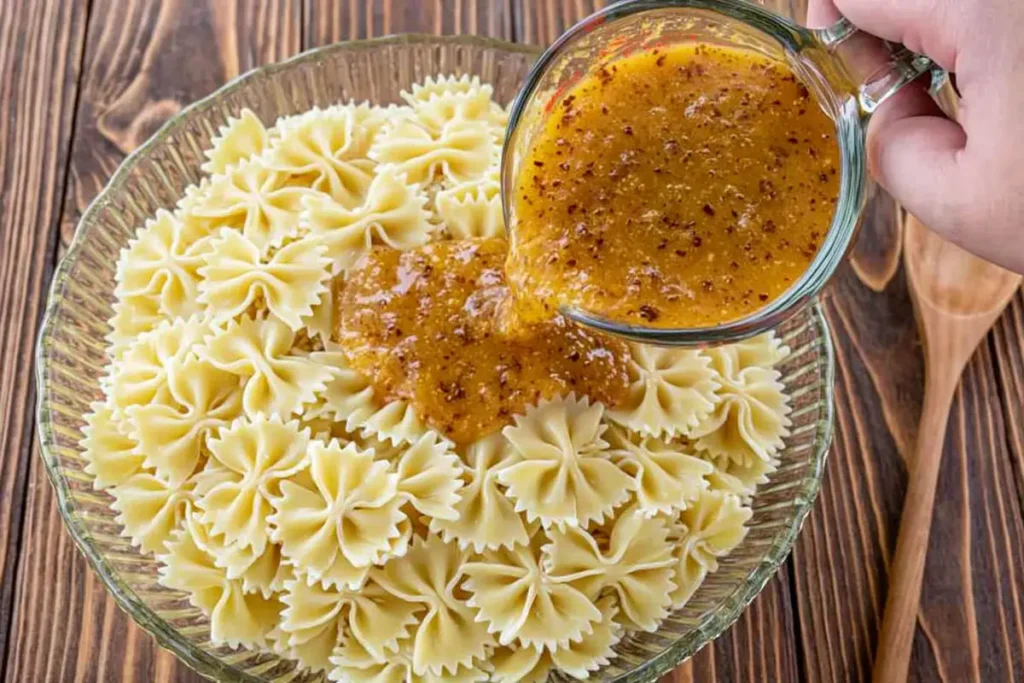 Bow Tie Pasta Salad with Salami, Mozzarella, and Italian Dressing 4 Bow Tie Pasta Salad pasta coated with zesty Italian dressing