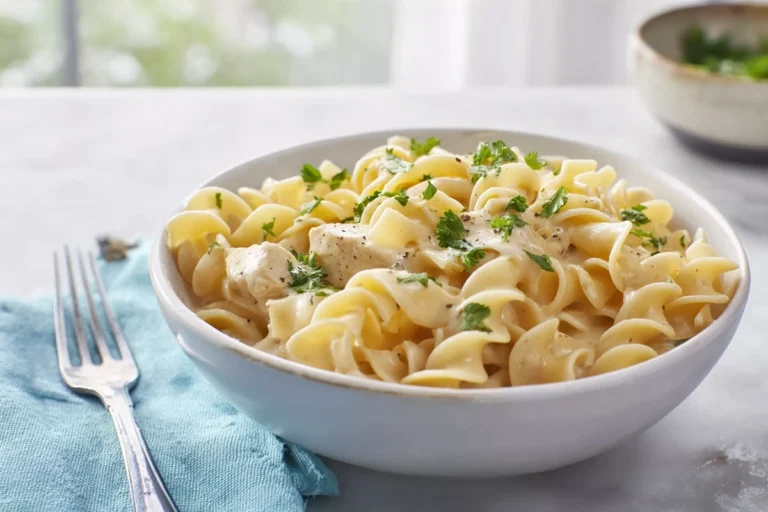 Photorealistic plated chicken buttered noodles in a modern kitchen