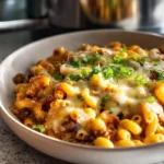 photorealistic chili mac in modern kitchen with melted cheese and garnish