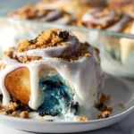 plated cookie monster cinnamon rolls with icing in a modern kitchen