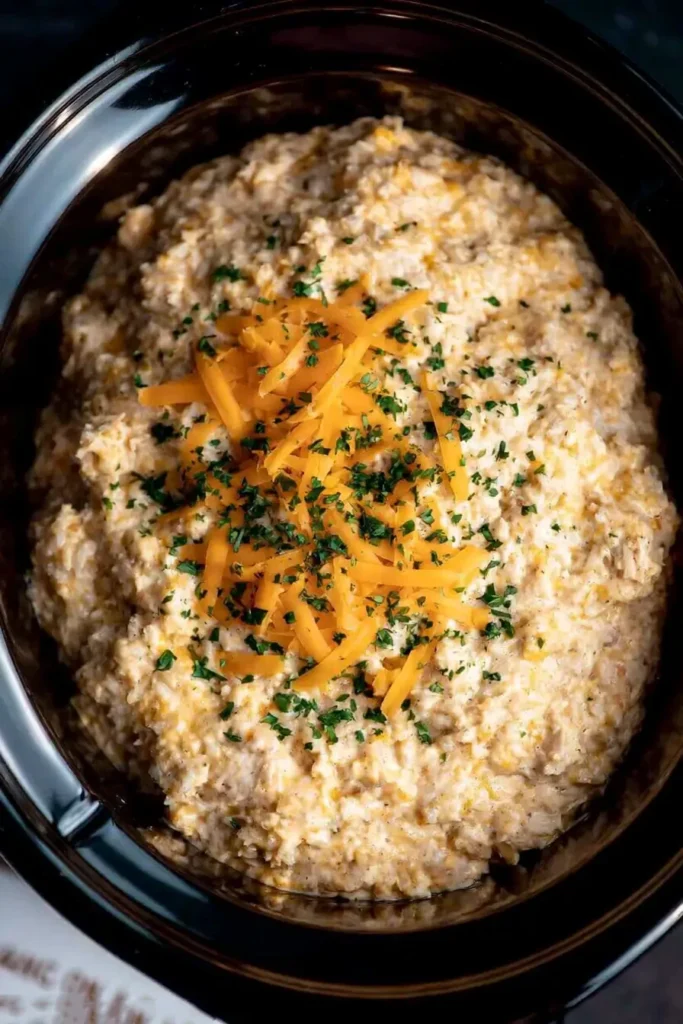 Crock Pot Chicken and Rice for Cozy Weeknight Dinners 3 Crock Pot Chicken and Rice showing creamy brown rice texture with melted cheddar