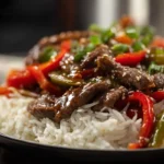 Photorealistic hero shot of Crockpot Pepper Steak plated in a modern kitchen