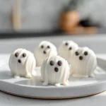 photorealistic hero shot of ghost oreo ball truffles on modern kitchen counter