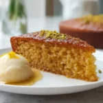 Freshly baked Greek Honey Cake cooling in a pan with syrup sheen