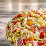 Grinder Pasta Salad in a modern kitchen with creamy dressing and fresh deli toppings