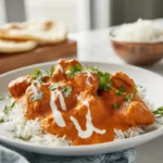 Indian Butter Chicken plated on a modern white plate with creamy tomato butter sauce
