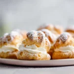 Light Choux Pastries arranged on a modern plate in a bright kitchen