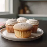 Photorealistic hero shot of mini chiffon cupcakes on a modern kitchen counter