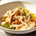 photorealistic mississippi chicken hero shot with tender shredded chicken and pepperoncini