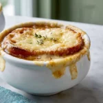 Hero image of Slow Cooker French Onion Soup with melted Gruyère cheese