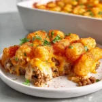 photorealistic hero shot of tater tot casserole with ground beef in modern kitchen