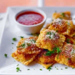 toasted ravioli hero shot crispy exterior plated dish in modern kitchen with marinara