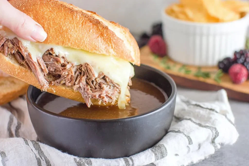 French dip sandwiches with shredded beef and rich au jus dipping broth
