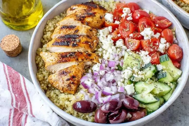 Greek Chicken Bowl final serving with grilled chicken quinoa feta olives and vegetables