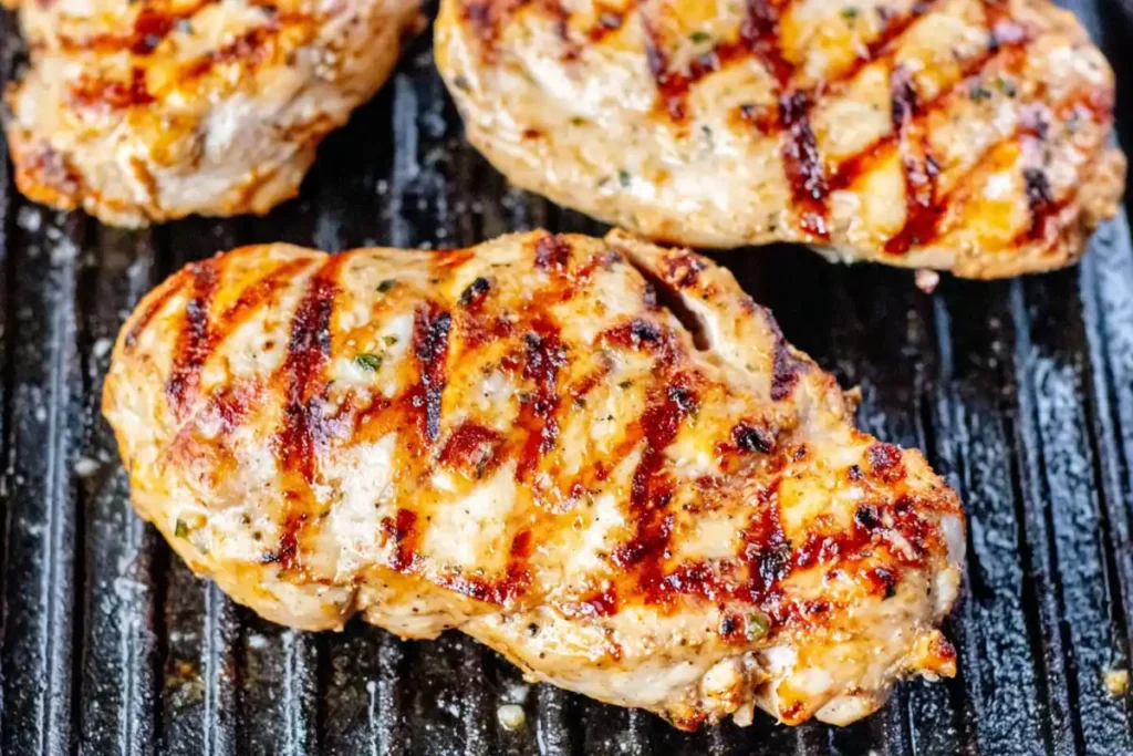 Greek Chicken Bowl grilled lemon oregano chicken cooking on a grill pan