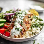 Greek Chicken Bowls served with grilled chicken, rice, and fresh vegetables
