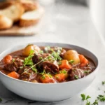 Finished slow cooker beef stew served in modern kitchen hero shot