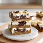 photorealistic hero shot of S’mores Cookie Bars stacked on a modern plate in a bright kitchen